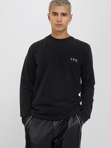 Young Poets T-shirt 'Lio' i svart: framsida