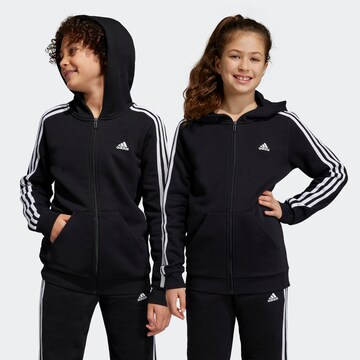 ADIDAS SPORTSWEAR Спортна жилетка с качулка 'Essentials' в черно: отпред