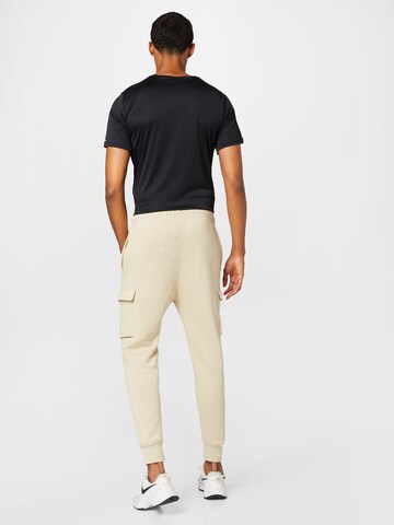 Effilé Pantalon cargo Nike Sportswear en beige