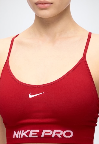 NIKE Bygelfri Sportbehå 'Pro' i röd