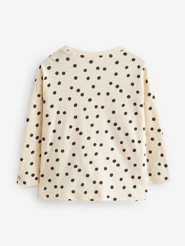 Tricou de la Next pe bej