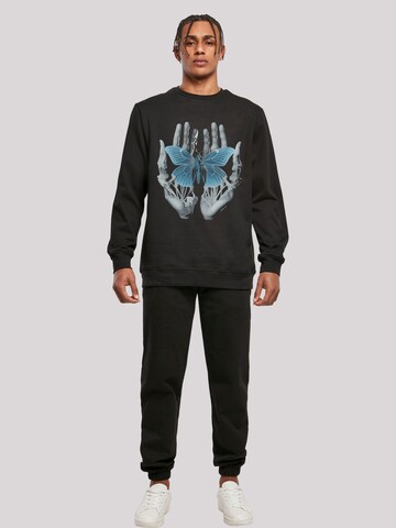 F4NT4STIC Sweatshirt 'Skelett Hände Schmetterling' in Schwarz