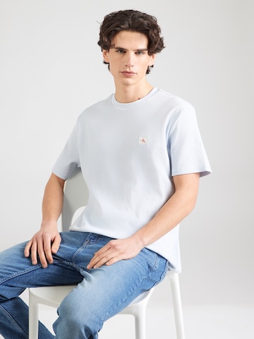Tricou de la Calvin Klein Jeans pe albastru: față