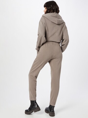 DRYKORN Tapered Broek 'DRYKORN x ABOUT YOU ONCE_CONSCIOUS' in Beige