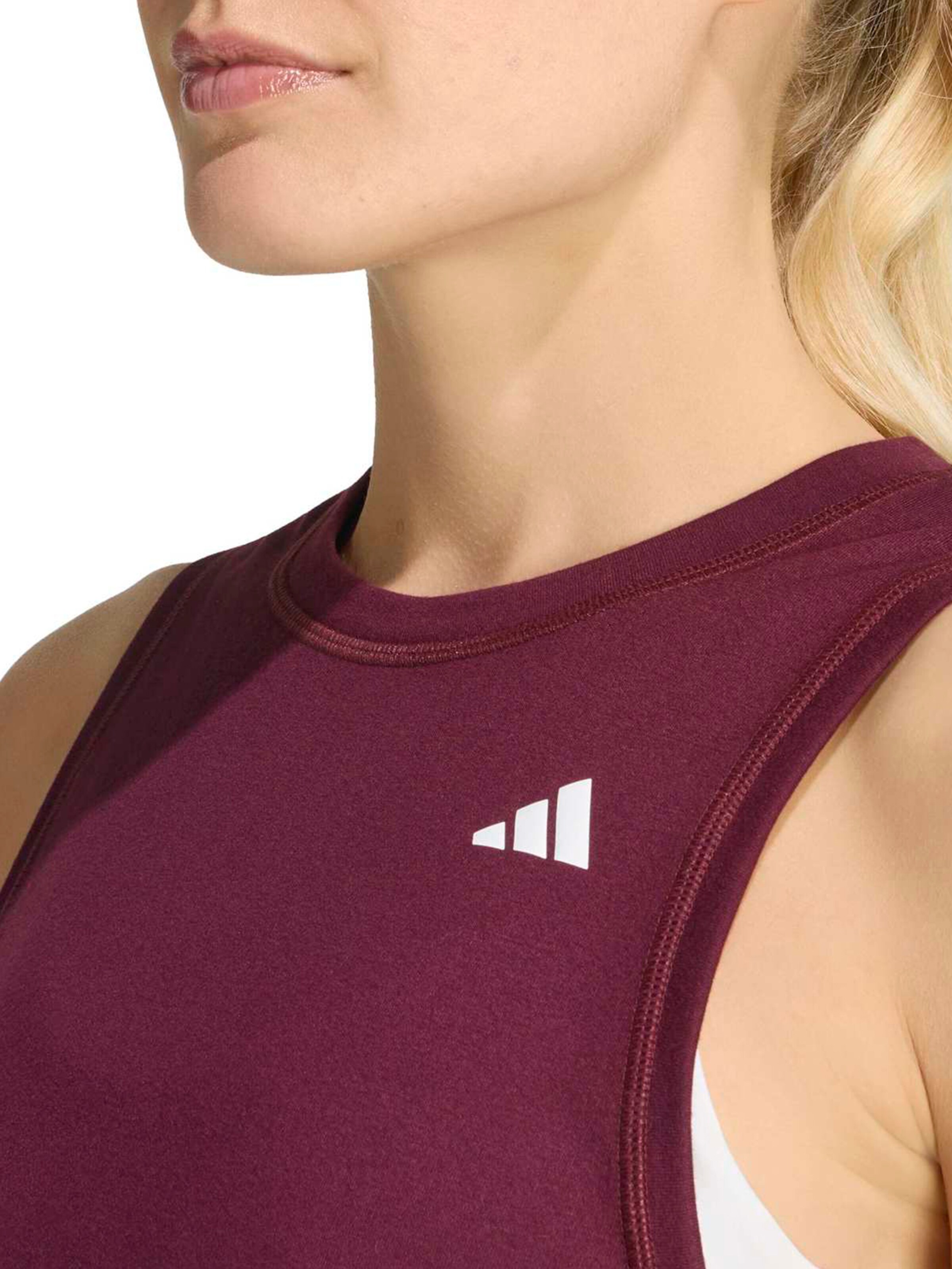 Top sportivo 'WE' di ADIDAS PERFORMANCE in marrone