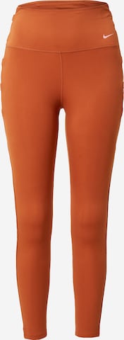 NIKE Skinny Workout Pants in Orange: front