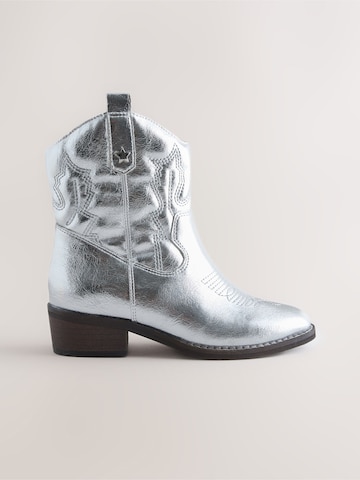 Next - Botas en plata