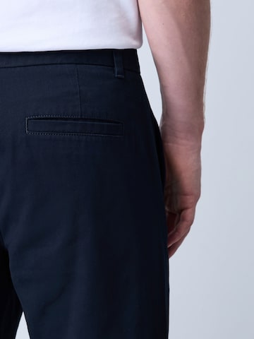 Next Slimfit Chinobyxa i blå