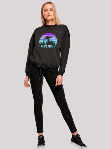 Sweat-shirt 'I believe UFO Alien Raumschiff Retro' F4NT4STIC en noir