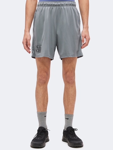 Regular Pantalon de sport 'Flex' NIKE en gris : devant