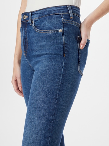 TOMMY HILFIGER Bootcut Jeans 'Izza' in Blau