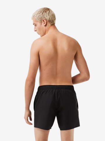 Pantaloncini da bagno di LACOSTE in nero