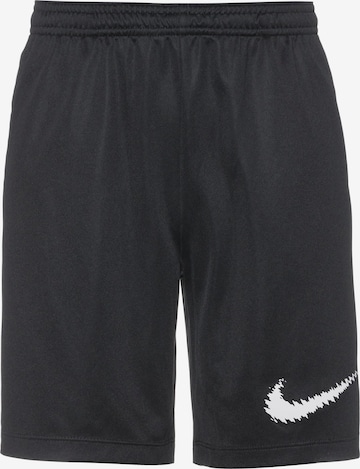 NIKE Sports trousers in Black: front