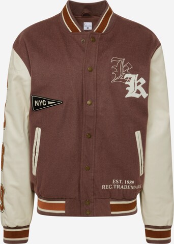 Karl Kani Between-Season Jacket 'Old English' in Brown: front