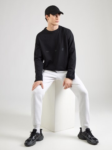 NIKE Koszulka funkcyjna 'Primary' w kolorze czarny