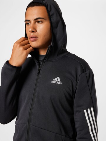 Veste de survêtement ADIDAS SPORTSWEAR en noir