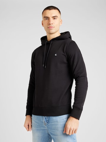 Sweat-shirt Calvin Klein Jeans en noir : devant