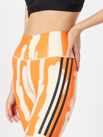 Skinny Pantaloni sportivi 'Thebe Magugu Bike' di ADIDAS SPORTSWEAR in arancione