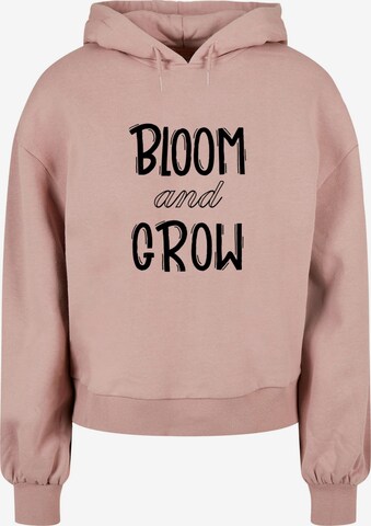 Merchcode Sweatshirt 'Spring - Bloom and grow' in Roze: voorkant