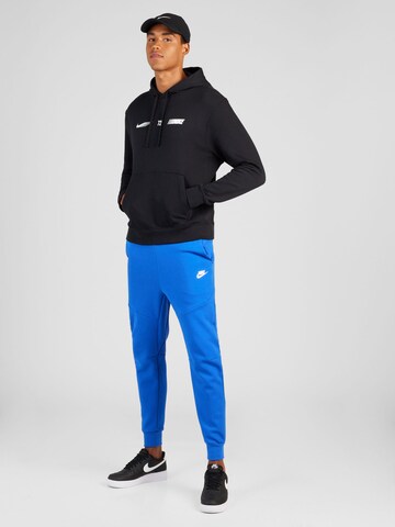 Tapered Pantaloni de la Nike Sportswear pe albastru
