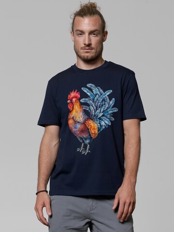 Maglietta 'Grimmiger Gockel' di Watapparel in blu: frontale