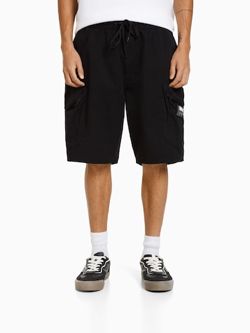 Bershka Loose fit Cargo Pants in Black: front