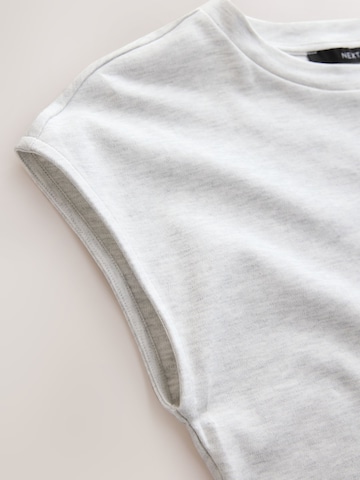 Tricou de la Next pe gri