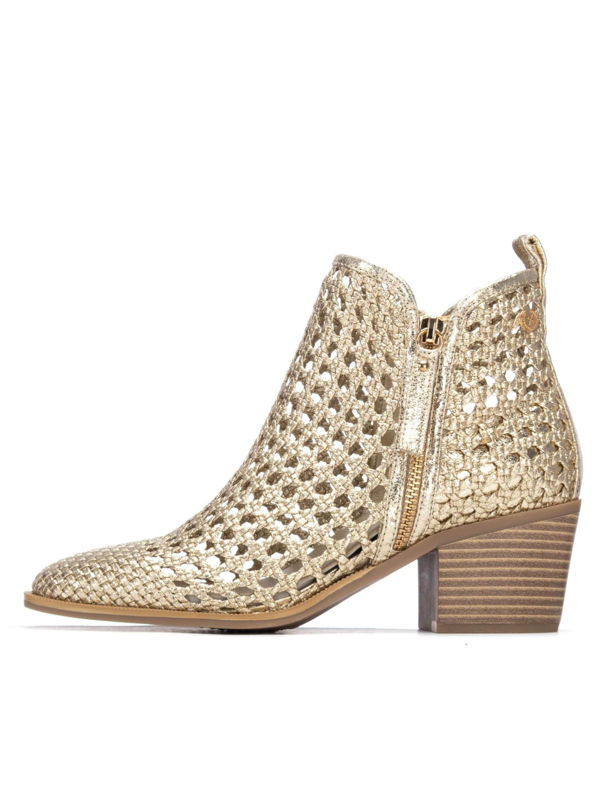 Xti - Botines en oro: frente