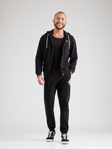 Champion Authentic Athletic Apparel Tapered Broek in Zwart