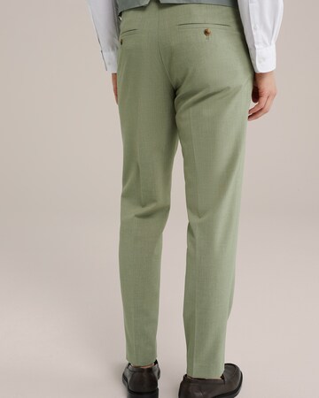 Tapered Pantaloni con piega frontale di WE Fashion in verde