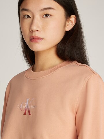 Felpa di Calvin Klein Jeans in arancione