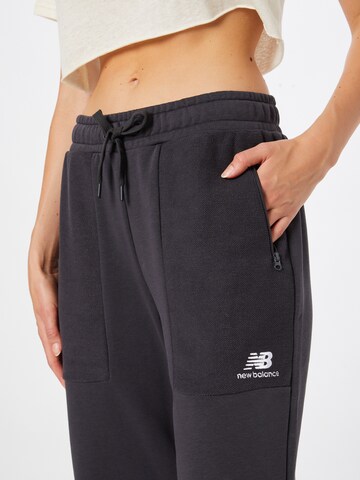 Tapered Pantaloni di new balance in nero