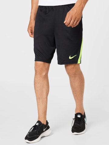 NIKE Regular Sports trousers in Black: front