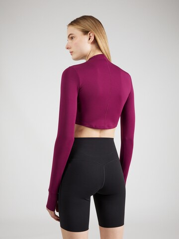 NIKE Performance shirt 'One Luxe Ess' in Red