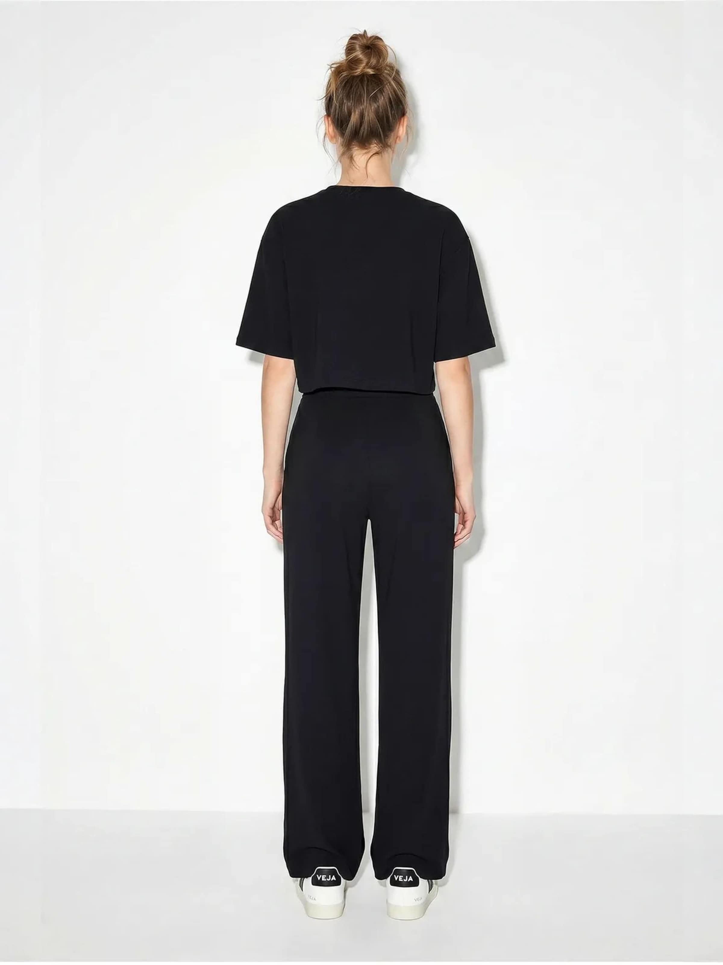Pantalons de tailleur Bianco Lucci en noir