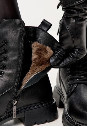 CESARE GASPARI Lace-up bootie in Black