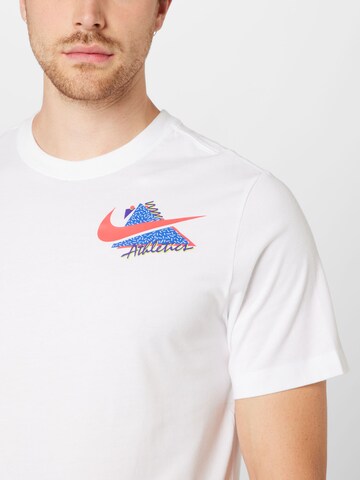 NIKE - Camiseta funcional en blanco