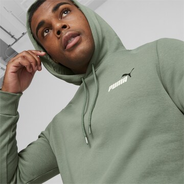 PUMASportska sweater majica 'Essentials+' - zelena boja