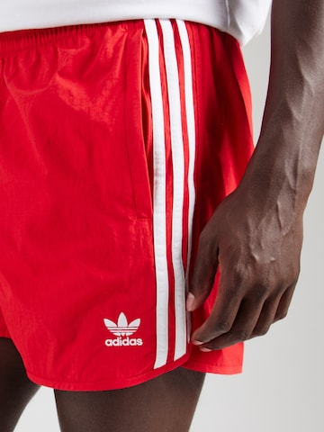 ADIDAS ORIGINALS Normalny krój Spodnie 'Adicolor Classics Sprinter' w kolorze czerwony