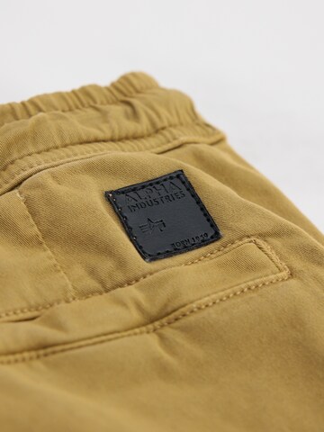 ALPHA INDUSTRIES Tapered Nadrág - zöld