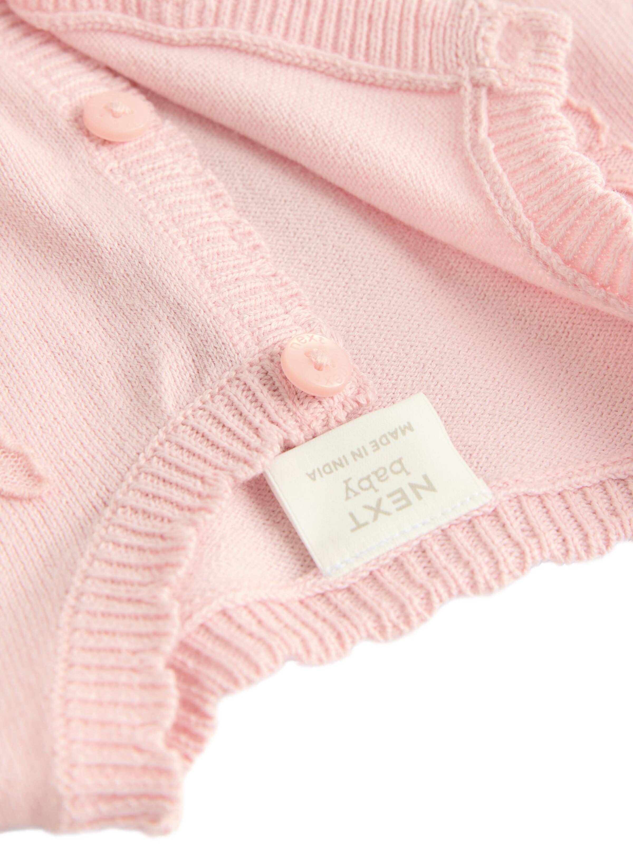 Next Neuletakki värissä vaaleanpunainen