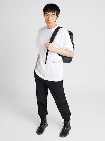 Calvin Klein Bluser & t-shirts 'OFF PLACEMENT' i hvid
