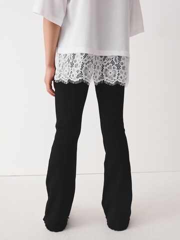 Next - Acampanado Leggings en negro