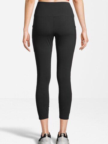 Skinny Pantaloni sport 'RAGA' de la FILA pe negru