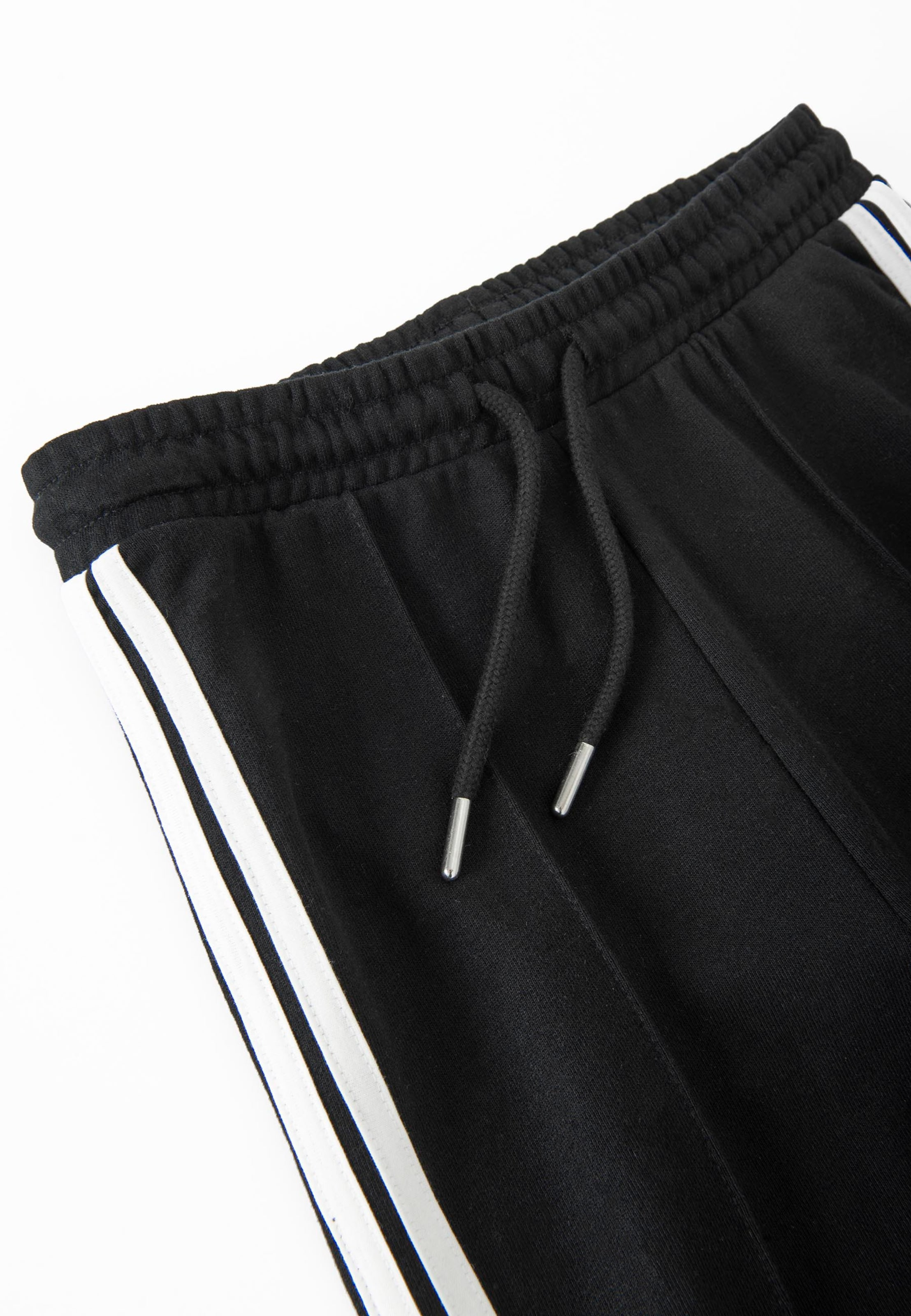 Cool Club - Acampanado Pantalón deportivo en negro