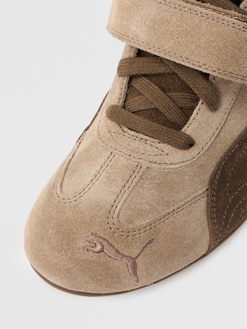 PUMA Sneakers hoog 'Speedcat Wedge' in Bruin