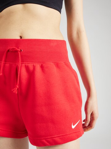 Nike Sportswear Loose fit Trousers 'Phoenix Fleece' in Red