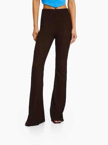 Bershka Flared Pants in Brown: front