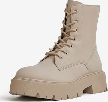 Bershka Lace-Up Ankle Boots in Beige: front