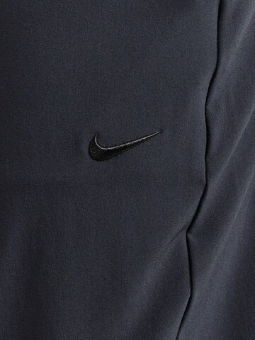 Effilé Pantalon de sport 'Unlimited' NIKE en noir